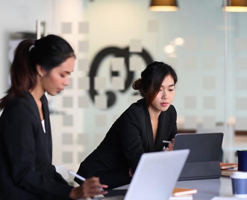 businesswoman-in-suit-experts-discussing-information-during-accounting-process-in-office-.jpg